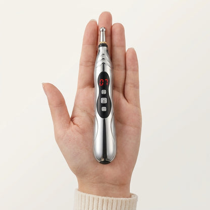 Tinnito Pen size reference — compact device shown in an adult hand for scale (1:1 square)